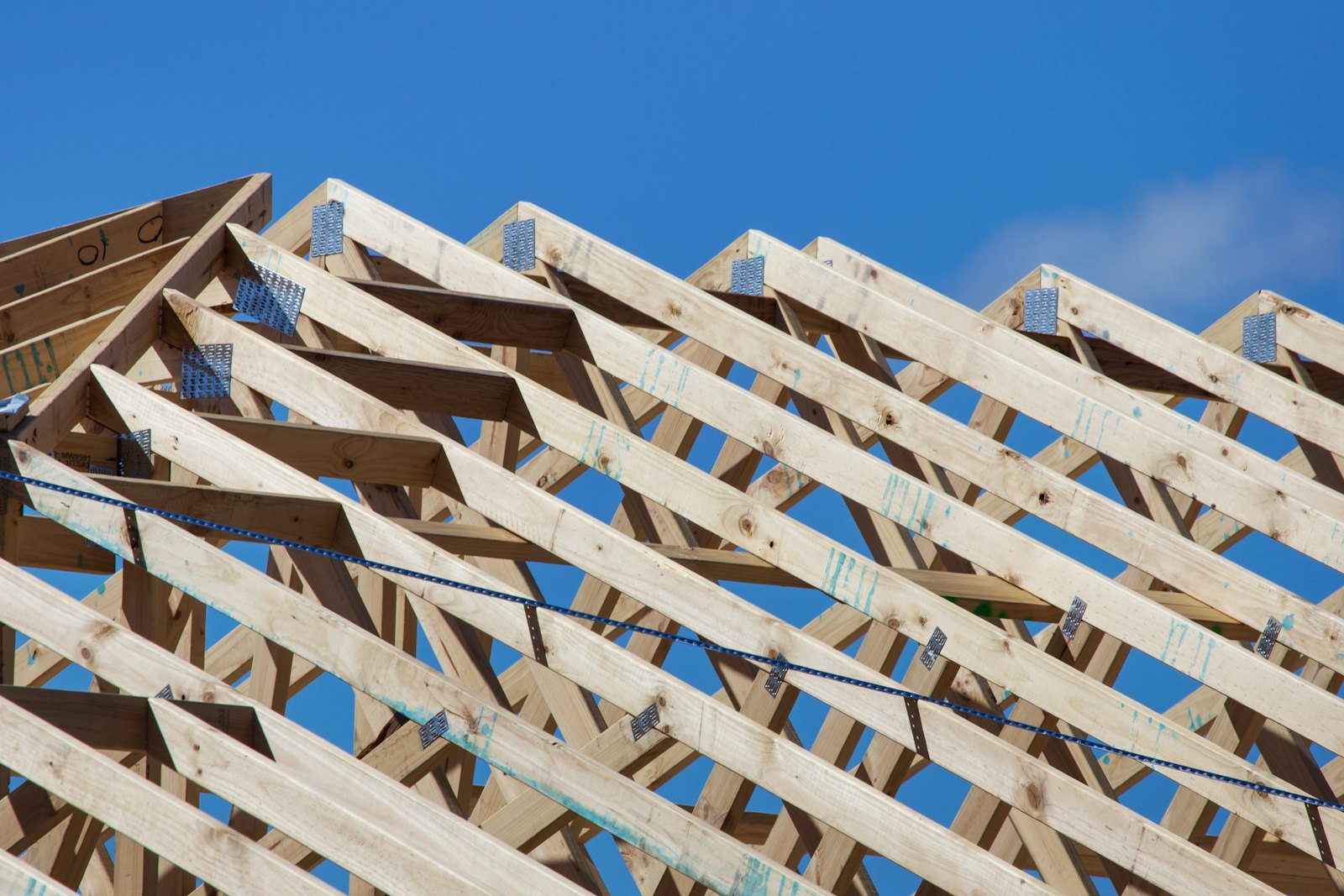 Roof trusses against a blue sky