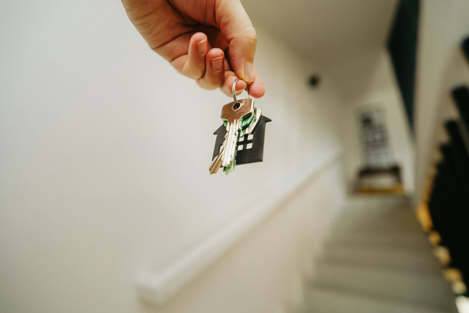 Hand holding house keys