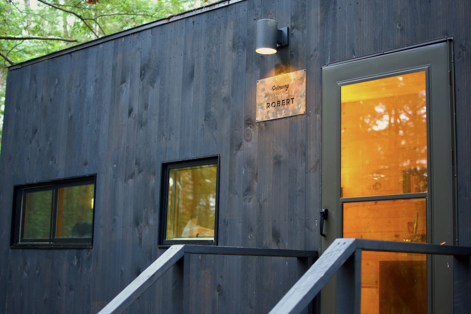 Dark wood-clad small house